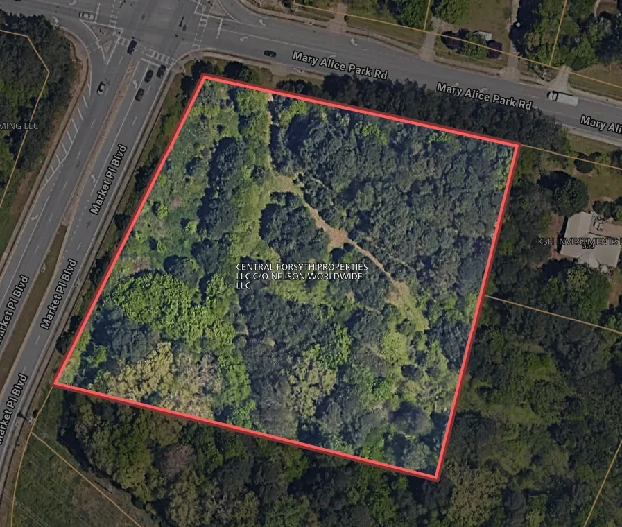 Aerial photo of a wooded parcel on Market Place Boulevard in Cumming, Georgia, bought for a residential assemblage
